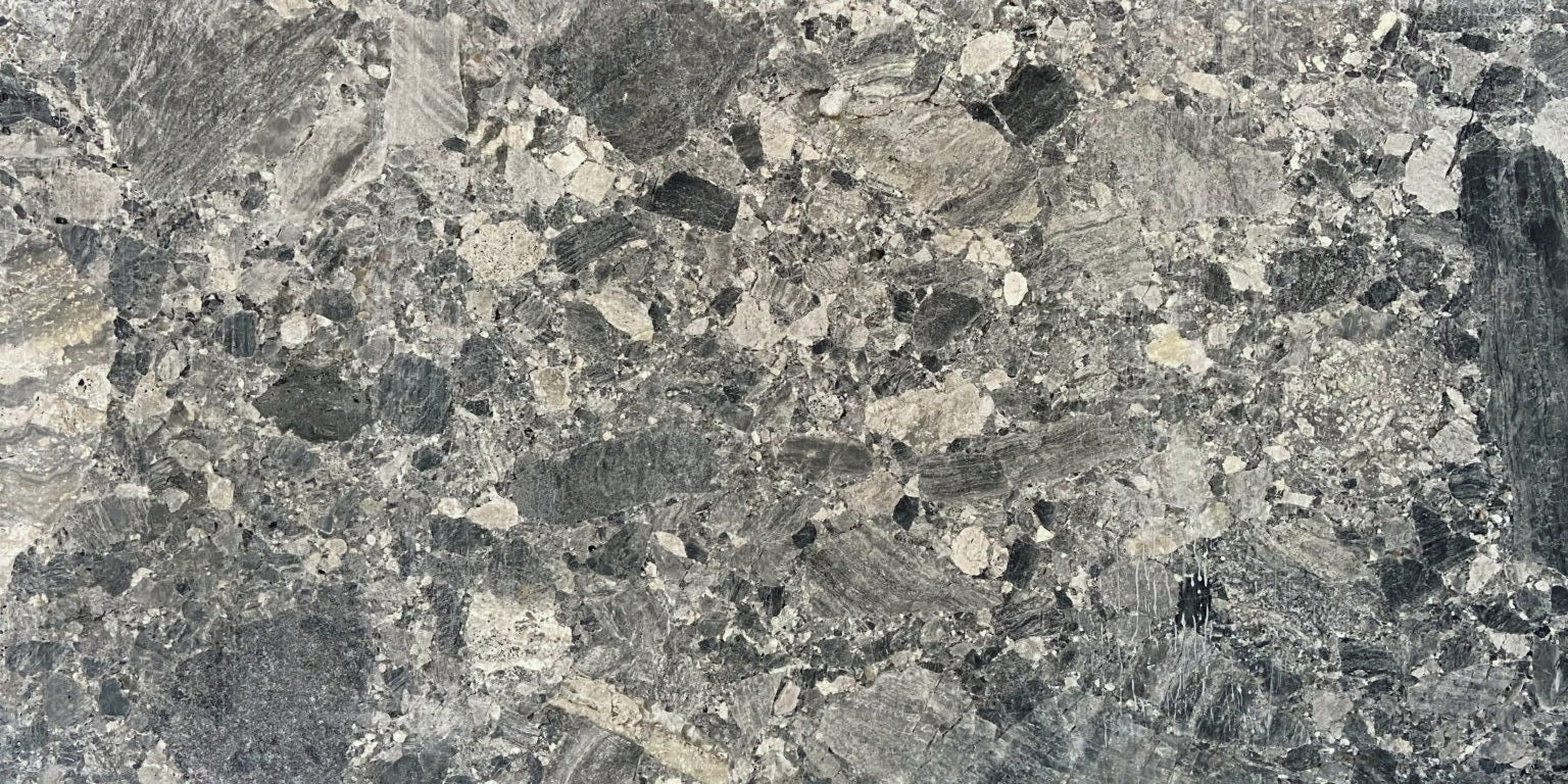 Close-up of a gray and black speckled  honed marble surface